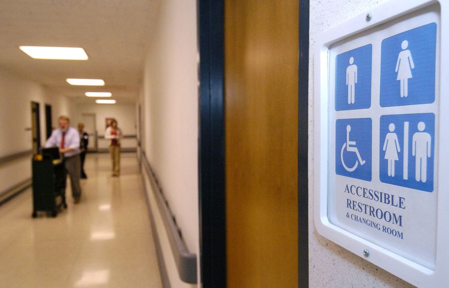 A new sign designates a third floor unisex restroom at a Kent State University student center in Kent, Ohio. (Associated Press)