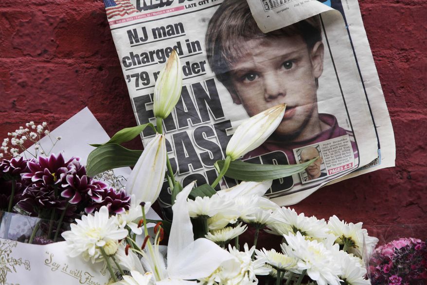 FILE - This May 28, 2012, file photo shows a newspaper with a photograph of Etan Patz at a makeshift memorial in the SoHo neighborhood of New York where Patz lived before his disappearance on May 25, 1979. The murder trial of Pedro Hernandez, the man accused in the child’s disappearance, ended Friday, May 8, 2015 with the jury hopelessly deadlocked after 18 days of deliberations, leaving unresolved a case that has haunted New York City for 36 years. (AP Photo/Mark Lennihan, File)