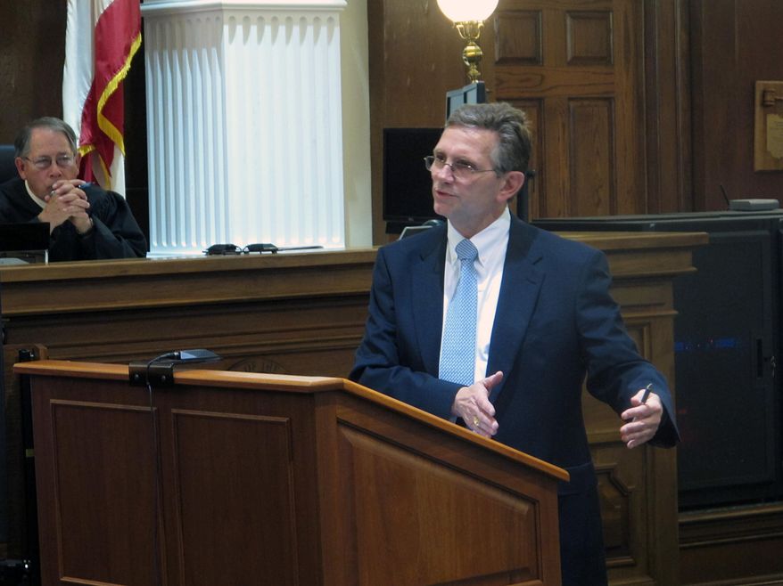 Defense attorney George Leach, right, defends his client against Union County charges of sexually assaulting three adopted daughters and his stepdaughter, as Judge David Faulkner observes, on Monday, May 11, 2015, in Marysville, Ohio. Leach says the defendant, an Ohio National guardsman, is innocent of charges including rape and sexual battery. (AP Photo/Andrew Welsh-Huggins)
