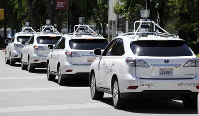 A row of Google self-driving Lexus cars at a Google event outside the Computer History Museum in Mountain View, California, May 13, 2014 file photo shows. (AP Photo/Eric Risberg) ** FILE **