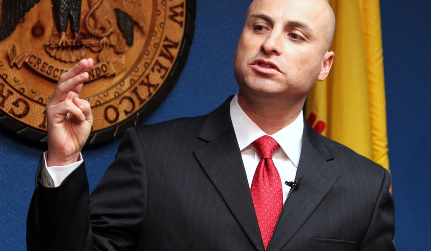 FILE - This Jan. 29, 2015 file photo New Mexico Attorney General Hector Balderas talks during a news conference in Albuquerque, N.M. Balderas announced proposed changes to the New Mexico Law Enforcement Academy Board on Tuesday, May 12, 2015, which he says will allow for more transparency and outline training changes amid a U.S. Justice Department overhaul of Albuquerque police. (AP Photo/Susan Montoya Bryan,File)