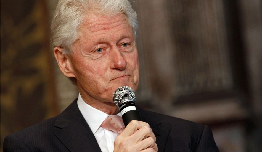 FILE - In this April 21, 2015 file photo, former President Bill Clinton listens to a question after speaking at Georgetown University in Washington. Clinton, brought in by the Univision television network to talk to advertisers on Tuesday, May 12, urged companies to follow a policy of "radical inclusiveness" in their business dealings. Univision Communication Inc., which operates the Spanish-speaking Univision and other cable and digital properties, was outlining future programming plans for potential business partners. The company invited Clinton for a 15-minute question-and-answer session with Alicia Menendez, reporter for the Fusion network, and singer Ricky Martin for entertainment. (AP Photo/Jacquelyn Martin, File)