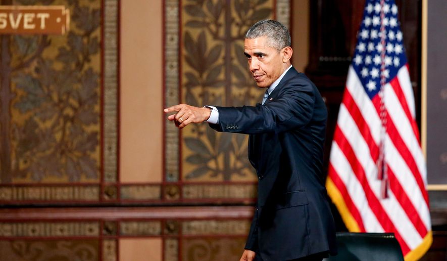 President Barack Obama points to the audience as he departs after speaking at the Catholic-Evangelical Leadership Summit on Overcoming Poverty at Gaston Hall at Georgetown University in Washington, Tuesday, May 12, 2015.  The president said that &amp;quot;it&#39;s a mistake&amp;quot; to think efforts to stamp out poverty have failed and the government is powerless to address it.  (AP Photo/Andrew Harnik)