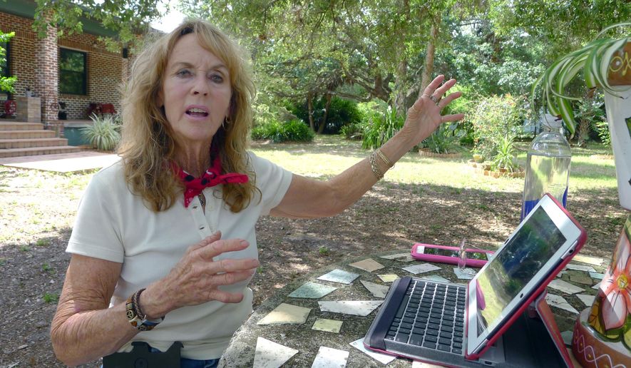 In this April 7, 2015 photo, BJ Gerald, a retired horse trainer who lives a few miles from a monkey breeding facility, talks to a reporter, in Alva, Fla. With three monkey-breeding facilities and a fourth in development, rural Hendry County has become one of the country’s biggest suppliers of research primates. Gerald said she opposes the primate companies. She doesn’t think the facilities are humane and believes they were improperly permitted by Hendry County authorities. (AP Photo/Tamara Lush)