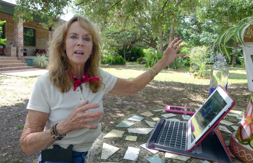 In this April 7, 2015 photo, BJ Gerald, a retired horse trainer who lives a few miles from a monkey breeding facility, talks to a reporter, in Alva, Fla. With three monkey-breeding facilities and a fourth in development, rural Hendry County has become one of the country’s biggest suppliers of research primates. Gerald said she opposes the primate companies. She doesn’t think the facilities are humane and believes they were improperly permitted by Hendry County authorities. (AP Photo/Tamara Lush)