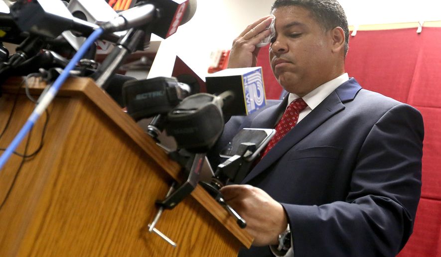 Dane County District Attorney Ismael Ozanne speaks during a press conference at the Dane County Public Safety Building in Madison, Wis. Tuesday, May 12, 2015. Ozanne said that Madison police officer Matt Kenny would not face charges in the shooting death of 19-year-old Tony Robinson in March 2015. (John Hart/Wisconsin State Journal via AP)