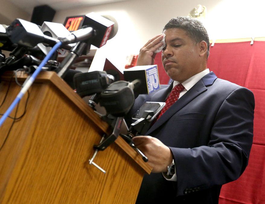 Dane County District Attorney Ismael Ozanne speaks during a press conference at the Dane County Public Safety Building in Madison, Wis. Tuesday, May 12, 2015. Ozanne said that Madison police officer Matt Kenny would not face charges in the shooting death of 19-year-old Tony Robinson in March 2015. (John Hart/Wisconsin State Journal via AP)