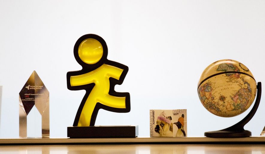 FILE - This May 12, 2008 file photo shows the AOL Running Man logo and other decorations at AOL's New York offices. Verizon on Tuesday, May 12, 2015 announced it is buying AOL for about $4.4 billion, advancing the telecom's push in both mobile and advertising fields. (AP Photo/Mark Lennihan, File)