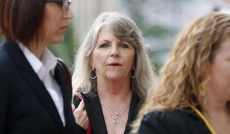 Maureen McDonnell, wife of former Gov. Bob McDonnell, enters 4th U.S. Circuit Court of Appeals for arguments in her husband&#39;s public corruption case in downtown Richmond Va., on Tuesday, May 12, 2015. (Mark Gormus/Richmond Times-Dispatch via AP) ** FILE **