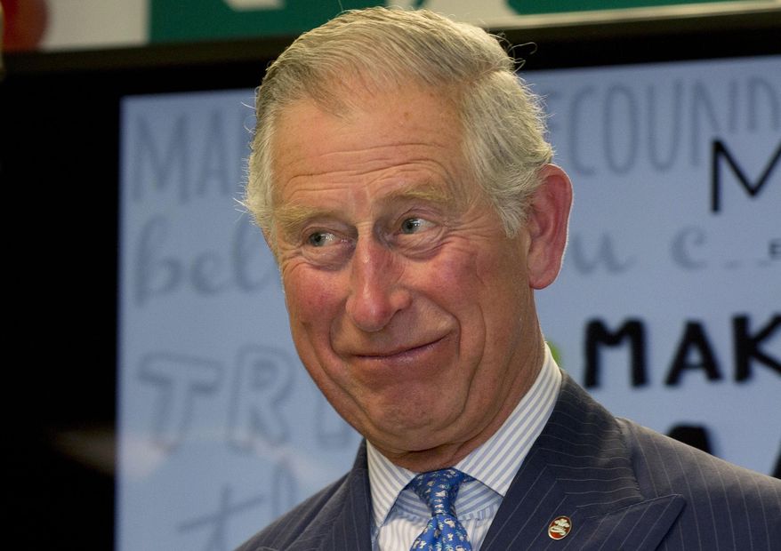RECROP OF XAG113 Britain's Prince Charles smiles as he hands out certificates to Prince's Trust 'Mark your Mark participants during a visit to British retailer Marks and Spencer in London, Wednesday, May 13, 2015. The Prince’s Trust 'Make your Mark' scheme is aimed at youth unemployment, giving underprivileged and socially disadvantaged young people opportunities to work. (AP Photo/Alastair Grant, Pool)