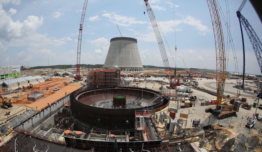 FILE- This June 13, 2014, file photo, shows construction on a new nuclear reactor at Plant Vogtle power plant in Waynesboro, Ga. Regulators say there's a "high probability" the nuclear plant under construction will see a delay longer than the three years already disclosed by its owners. (AP Photo/John Bazemore, File)