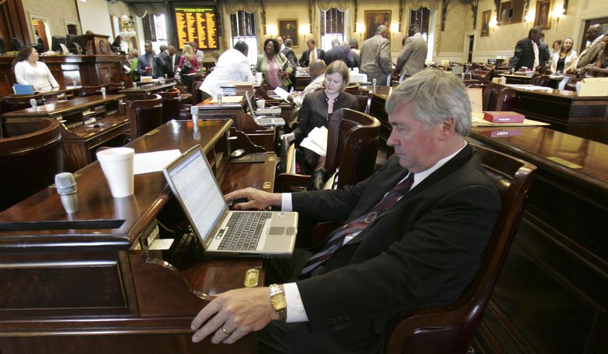 In this May 21, 2009, file photo, state Rep. Nelson Hardwick, R- Surfside Beach, looks at his computer as other members of the House pack up as the legislative session ends at the Statehouse in Columbia, S.C. Hardwick has resigned following a complaint investigated by House Speaker Jay Lucas. (AP Photo/Mary Ann Chastain, File)