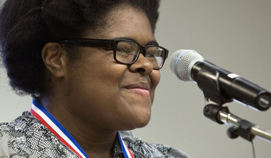 ADVANCE FOR USE SUNDAY, MAY 17 - In this photo taken Friday, May 8, 2015, Johnessa Richard, 17, smiles after she receives the 2015 Governor's Medallion at the First College 10-year Celebration at Fred W. Beazley Portsmouth Campus in Portsmouth, Va. Johnessa will graduate from Tidewater Community College this month and next month graduates from I.C. Norcom High School. She plans to transfer to Old Dominion University this fall to major in biology. (The' N. Pham/The Virginian-Pilot via AP) MAGS OUT