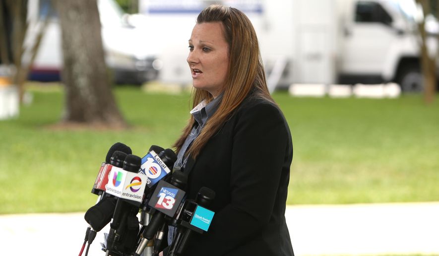 Lake Mary Police officer Bianca Gillett speaks to media about Monday’s shooting involving George Zimmerman, Tuesday, May 12, 2015, in the Orlando suburb of Lake Mary, Fla. Police recovered a handgun from George Zimmerman and took two guns from a man accused of shooting at Zimmerman while both were driving, authorities said Tuesday. Detectives are still investigating and no charges have been filed against Zimmerman or Apperson. Documents released Tuesday show that detectives are investigating the shooting as a possible aggravated assault with a deadly weapon without intent to kill. (Charles King/Orlando Sentinel via AP) MAGS OUT; NO SALES