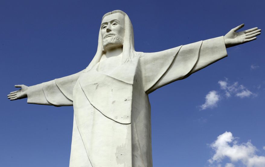 File - In this May 6, 2015 file photo, a 66-foot tall statue of Jesus stands near Eureka Springs, Ark. Voters in Eureka Springs voted overwhelmingly Tuesday, May 12, 2015 to keep a measure that would prohibit the city and private businesses from discriminating against someone based on their sexual orientation and gender identity. (AP Photo/Danny Johnston, File)