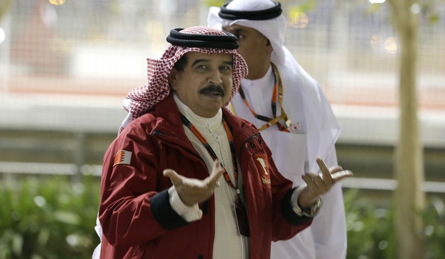 King Hamad bin Isa Al Khalifa of Bahrain arrives to the Bahrain Formula One Grand Prix at the Formula One Bahrain International Circuit in Sakhir, Bahrain, on April 19, 2015. (Associated Press) **FILE**