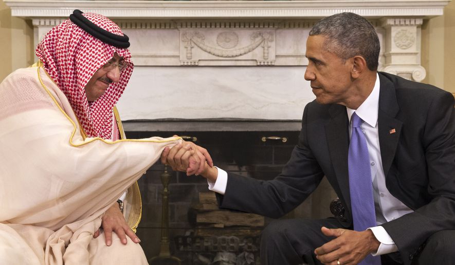 President Barack Obama shakes hands with Saudi Arabia&#39;s Crown Prince Mohammed bin Nayef during their meeting in the Oval Office of the White House in Washington, Wednesday, May 13, 2015.  (AP Photo/Jacquelyn Martin)
