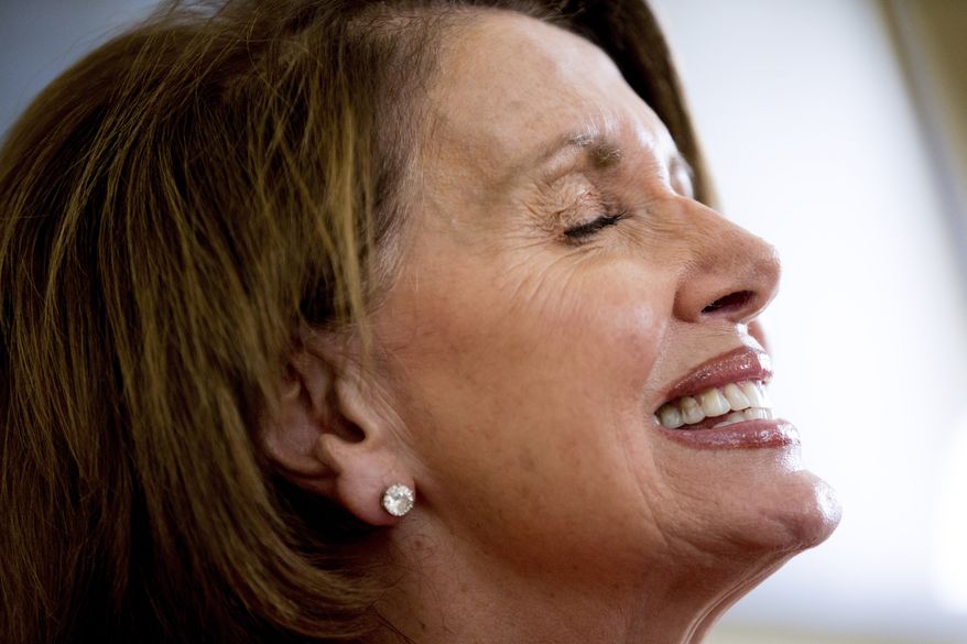 House Minority Leader Nancy Pelosi of Calif., smiles as she speaks to the Associated Press in her office on Capitol Hill in Washington, Wednesday, May 13, 2015. (AP Photo/Andrew Harnik) ** FILE **