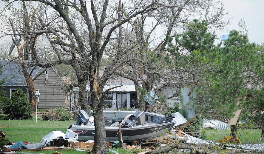 Tornado damage is shown on Sunday, May 10, 2015, in Delmont, S.D., after a tornado hit the town earlier in the day. The tornado hit the town southwest of Sioux Falls on Sunday morning, injuring nine people and damaging at least 20 buildings, including a century-old church. Two people remain hospitalized. Crews are working to restore water, electricity and phone service. (Joe Ahlquist/The Argus Leader via AP) NO SALES