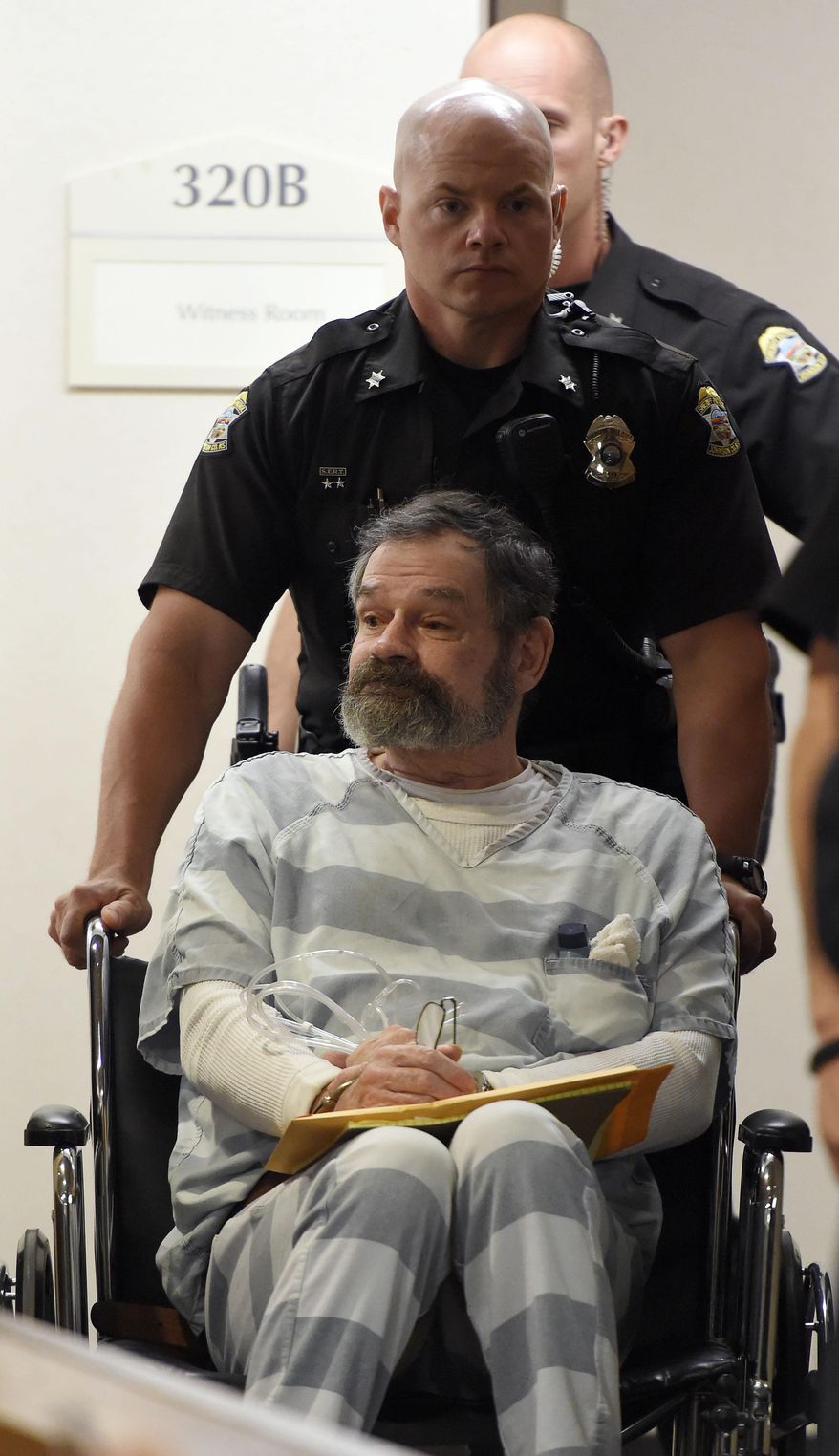 Frazier Glenn Miller is brought to court for an appearance on Thursday, May 14, 2015, at the Johnson County Courthouse in Olathe, Kan. Miller is charged with capital murder in April 13, 2014, shooting deaths of 69-year-old William Lewis Corporon, 14-year-old Reat Griffin Underwood and 53-year-old Terri LaMano in Overland Park, Kansas. (John Sleezer/The Kansas City Star via AP)