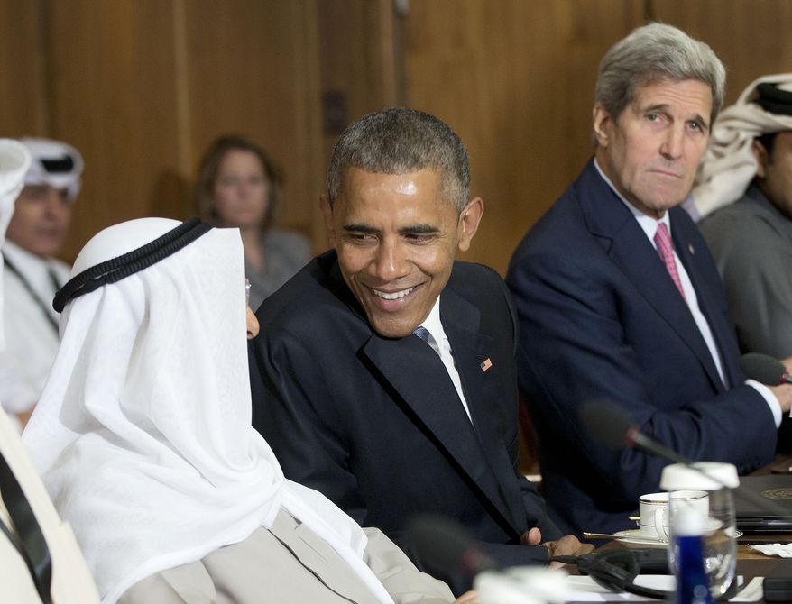 President Barack Obama, accompanied by Secretary of State John Kerry, talks with with Kuwaiti Emir Sheikh Sabah Al-Ahmad Al-Sabah during a meeting with Gulf Cooperation Council leaders and delegations at Camp David, Md., Thursday, May 14, 2015. Obama and leaders from six Gulf nations are trying to work through tensions sparked by the U.S. bid for a nuclear deal with Iran, a pursuit that has put regional partners on edge. Obama is seeking to reassure the Gulf leaders that the U.S. overtures to Iran will not come at the expense of commitments to their security. (AP Photo/Pablo Martinez Monsivais)