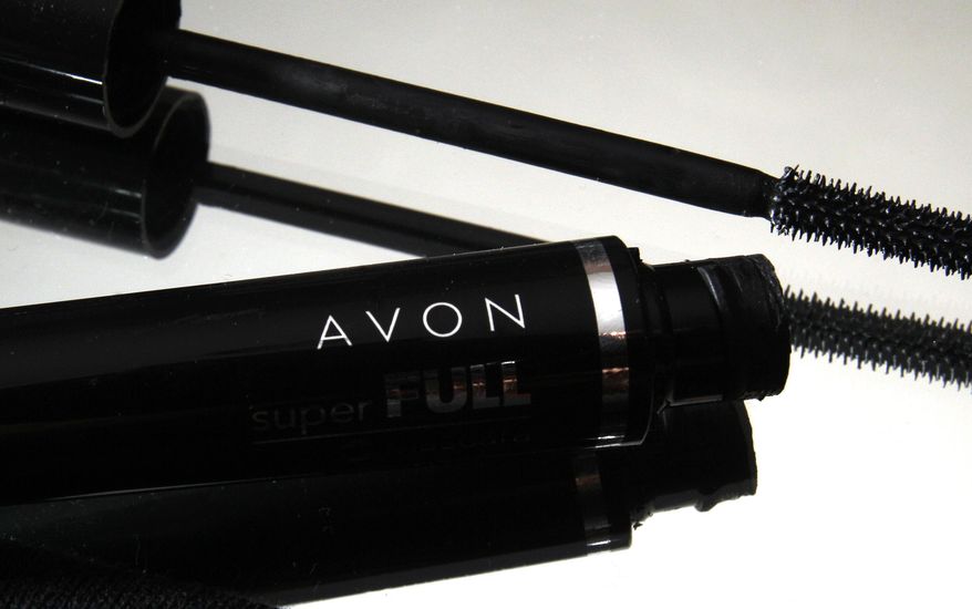 FILE - This July 28, 2010 file photo shows a container and brush of Super Full mascara by Avon in North Andover, Mass. Shares of Avon were halted three times in volatile trading Thursday, May 14, 2015, after a regulatory filing announcing an $8 billion takeover bid for company came under scrutiny. (AP Photo/Elise Amendola, File)