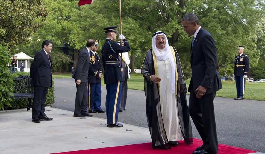 President Barack Obama, right, and Sheikh Sabah Al-Ahmed Al-Jaber Al-Sabah, Emir of the State of Kuwait, turn enter the White House as as Sheikh Sabah Al-Ahmed Al-Jaber Al-Sabah, arrives at the South Lawn of the White House in Washington, Wednesday, May 13, 2015. Gulf nation leaders gathered in Washington to warn President Barack Obama of the risks of completing a nuclear deal with Iran. Obama will try to convince them of the potential benefits for the region. (AP Photo/Carolyn Kaster)