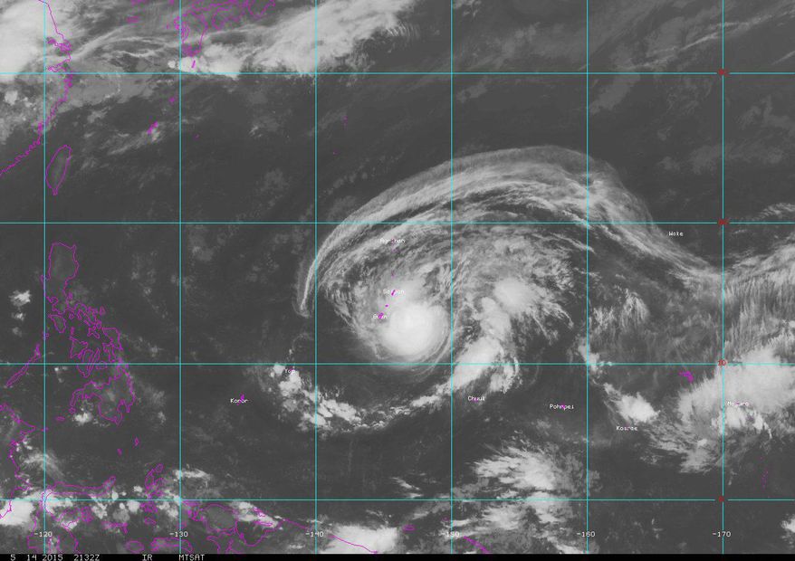 This satellite image provided by NOAA, shows Typhoon Dolphin near Guam, Friday, May 15, 2015. Residents in Guam are bracing for potentially damaging winds and flooding as the typhoon approaches the U.S. territory. (NOAA via AP)