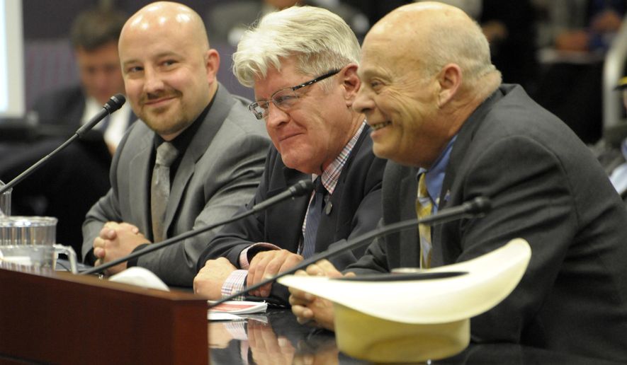 Nevada's Assistant State Controller Geoffrey Lawrence, left, State Controller Ron Knecht and Assemblyman Jim Wheeler, R-Minden present an alternative tax plan to Gov. Brian Sandoval's plan during a budget hearing Thursday, May 14, 2015, inside the Nevada Legislative Building in Carson City. Sandoval is releasing an updated, hybrid tax plan that he says is an improvement on his original proposal, but he’ll have to make sure a bloc of anti-tax Assembly members that back Knecht's plan, don't derail it.(AP Photo/Lisa J. Tolda)