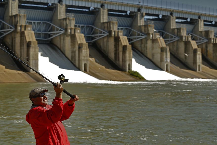 FILE - In this April 29, 2015, file photo, Antonio Pinon casts into the spillway of Lavon Lake to catch fish after the Army Corps of Engineers opened up three doors in the dam in Lavon, Texas. Recent heavy rains have helped Texas emerge from the worst of the years-long drought. The U.S. Drought Monitor on Thursday, May 14, 2015, indicated Texas, for the first time since mid-2012, is no longer in the "exceptional drought" category. (Nathan Hunsinger/The Dallas Morning News via AP) MANDATORY CREDIT; MAGS OUT; TV OUT; INTERNET USE BY AP MEMBERS ONLY; NO SALES