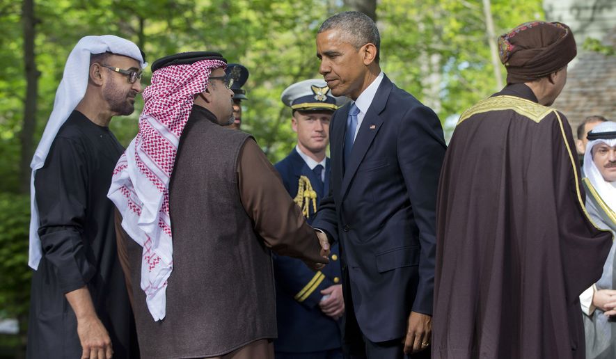 President Barack Obama, center, bids farewell to from left., Abu Dhabi crown prince Sheikh Mohammed bin Zayed Al Nahyan; Bahrain Crown Prince Prince Salman bin Hamad Al-Khalif and Deputy Prime Minister of Oman, Sayyid Fahad Bin Mahmood Al Said after their meetings at Camp David in Maryland, Thursday, May 14, 2015. Obama and leaders from six Gulf nations are trying to work through tensions sparked by the U.S. bid for a nuclear deal with Iran, a pursuit that has put regional partners on edge. Obama is seeking to reassure the Gulf leaders that the U.S. overtures to Iran will not come at the expense of commitments to their security. (AP Photo/Pablo Martinez Monsivais)