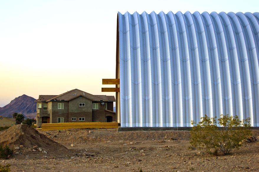ADVANCE FOR WEEKEND EDITIONS, MAY 16-17 - This photo taken March 28, 2015, shows the exterior of a large, eco-friendly, arch-shaped home Aeron Tozier is building in Henderson, Nev. He will live there, but it's also a prototype, as he plans to build a business developing such homes. (L.E. Baskow/Las Vegas Sun via AP) LAS VEGAS REVIEW-JOURNAL OUT