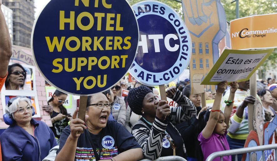 Protestors join other pro-tenant activists at Foley Square to call on the state legislature to strengthen rent laws Thursday, May 14, 2015, in New York. (AP Photo/Frank Franklin II)