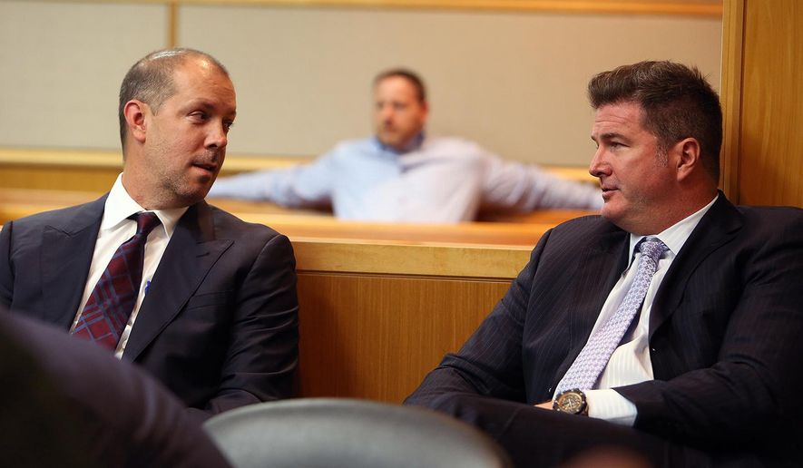 In a Wednesday, May 13, 2015 photo, attorneys Adam Filthaut and Robert Adams, right, talk in court during testimony at the Pinellas County Justice Center in Clearwater, Fla. A Florida judge will soon decide if three well-known Tampa attorneys tricked a rival lawyer into getting a DUI, all to help their defamation case. (Jay Conner/Tampa Tribune via AP, Pool)