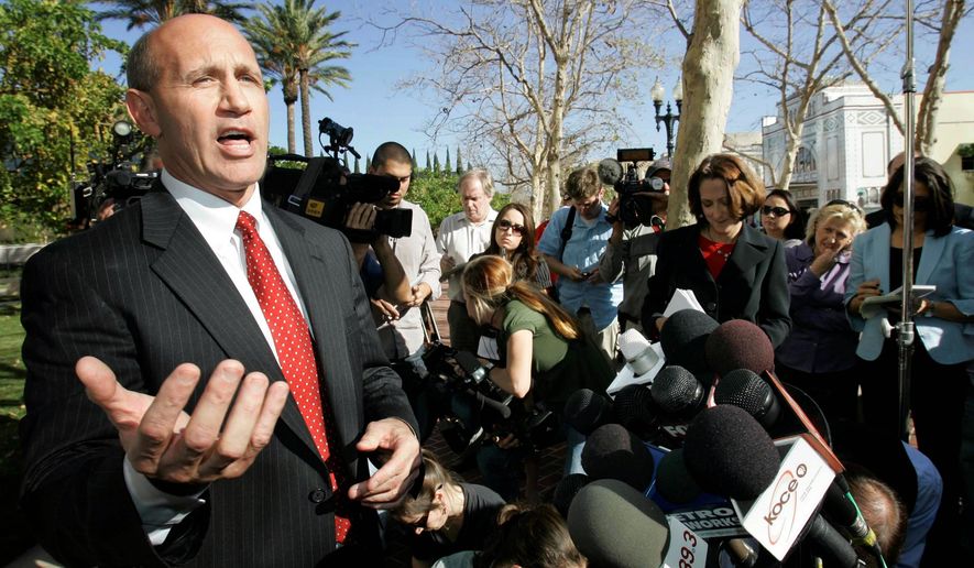 FILE - In this Jan. 16, 2009, file photo, former Orange County Sheriff Mike Carona speaks at a news conference outside court in Santa Ana, Calif. Carona has been freed from a Kentucky prison, where he served 52 months of a 66-month sentence for felony witness tampering. (AP Photo/Nick Ut, File)