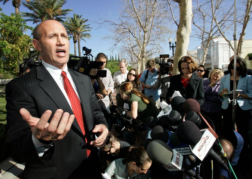 FILE - In this Jan. 16, 2009, file photo, former Orange County Sheriff Mike Carona speaks at a news conference outside court in Santa Ana, Calif. Carona has been freed from a Kentucky prison, where he served 52 months of a 66-month sentence for felony witness tampering. (AP Photo/Nick Ut, File)
