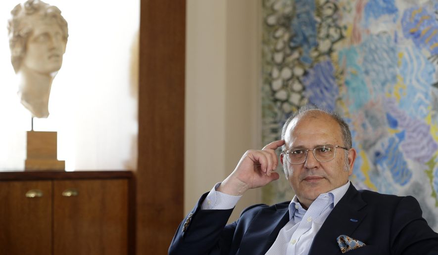 Greece’s culture minister Nikos Xydakis listens a question during an interview with the Associated Press in Athens, Friday, May 15, 2015. Xydakis says he has not ruled out court action for the return of the ancient Parthenon Sculptures from the British Museum in London, but diplomacy still seems the most effective option. (AP Photo/Thanassis Stavrakis)