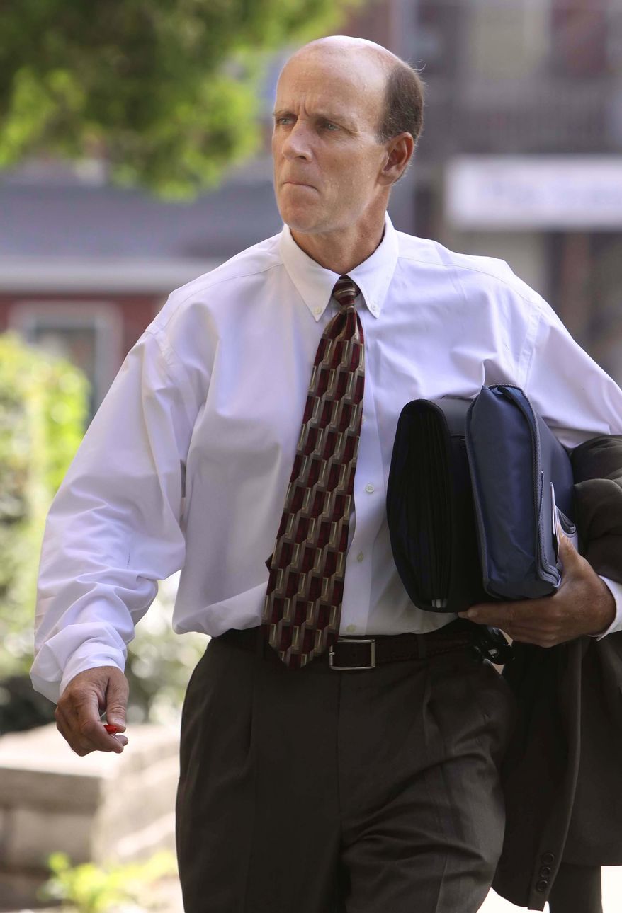 FILE - In this Wednesday July 15, 2009 file photo, defendant Calvin Harris heads to Tioga County Court in Owego, N.Y. On Friday, May 15, 2015 a judge declared a mistrial in the murder case against Harris with two previous convictions for killing his estranged wife, Michele, in the hours after the Sept. 11 terrorist attacks. (Jeff Richards/The Star-Gazette via AP, Pool)