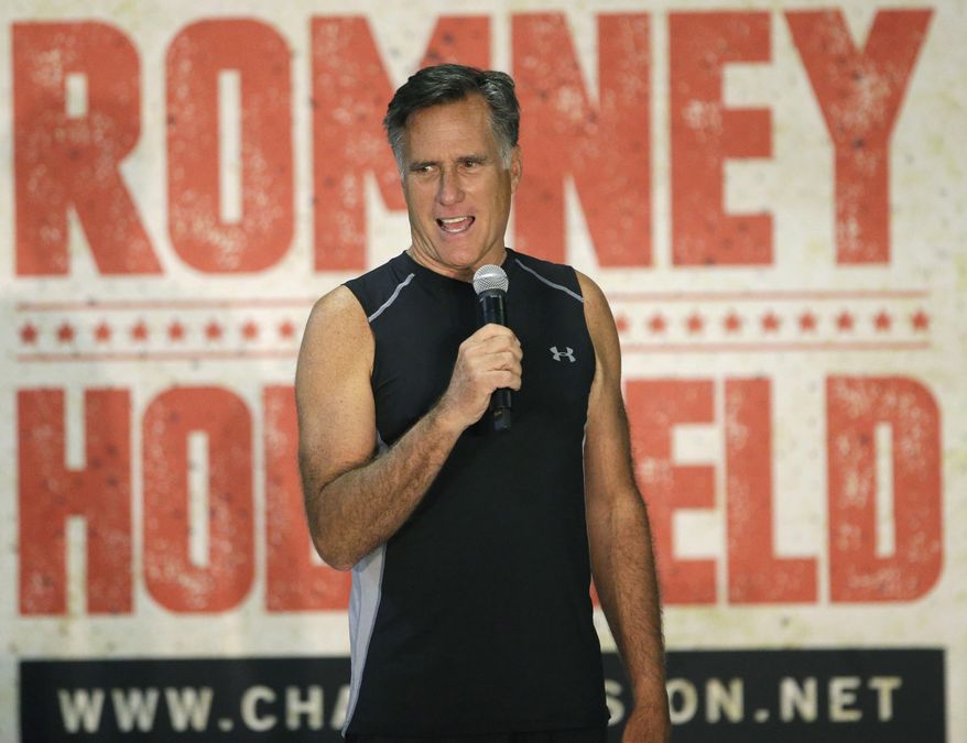 Former Republican presidential candidate Mitt Romney speaks during an official weigh-in with five-time heavyweight boxing champion Evander Holyfield, Thursday, May 14, 2015, in Holladay, Utah. Romney and Holyfield are set to square off at a charity fight on Friday, May 15, in Salt Lake City. The black-tie event will raise money for the Utah-based organization CharityVision, which helps doctors in developing countries perform surgeries to restore vision in people with curable blindness. (AP Photo/Rick Bowmer)