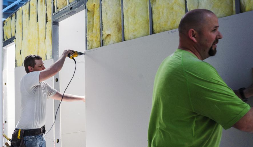 D W Lurvey Construction workers continue making progress on Hurley Medical Center's new Pediatric Residency Clinic and Pediatric Specialty Clinic space on Wednesday, May 6, 2015, on the second floor of the Flint Farmers' Market in downtown Flint, Mich. (Sam Owens/The Flint Journal-MLive.com via AP)