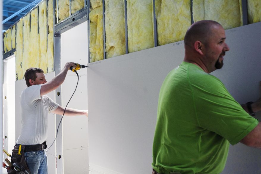 D W Lurvey Construction workers continue making progress on Hurley Medical Center's new Pediatric Residency Clinic and Pediatric Specialty Clinic space on Wednesday, May 6, 2015, on the second floor of the Flint Farmers' Market in downtown Flint, Mich. (Sam Owens/The Flint Journal-MLive.com via AP)