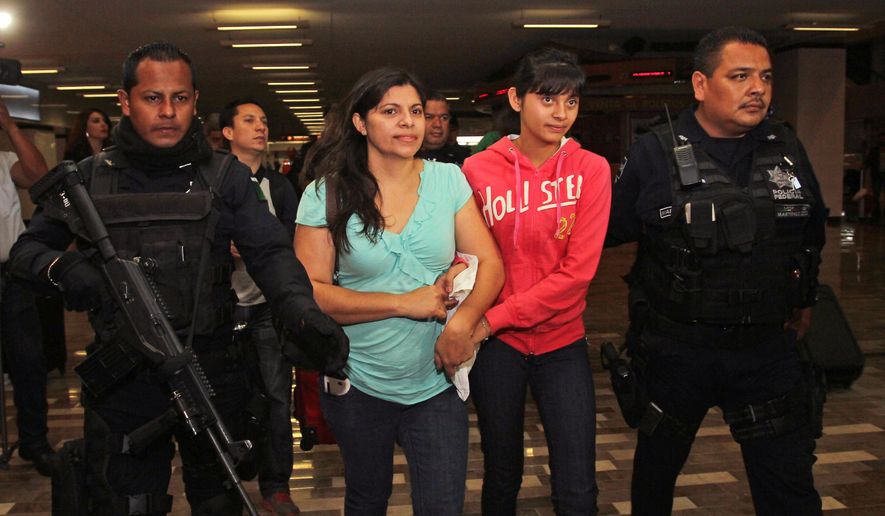 Houston resident Dorotea Garcia and 13-year-old Alondra Diaz are escorted by police as they arrive at the international airport in Guadalajara, Mexico, early Saturday May 16, 2015. Garcia got her long-missing daughter back and headed for home, concluding an eight-year search after Alondra was taken to Mexico in 2007 by her father, Reynaldo Diaz, without her mother's consent, and her whereabouts had not been known until recently. The case gained international attention last month after Mercado erroneously ruled that 14-year-old Alondra Luna was the missing girl and ordered her turned over to Garcia. (AP Photo)