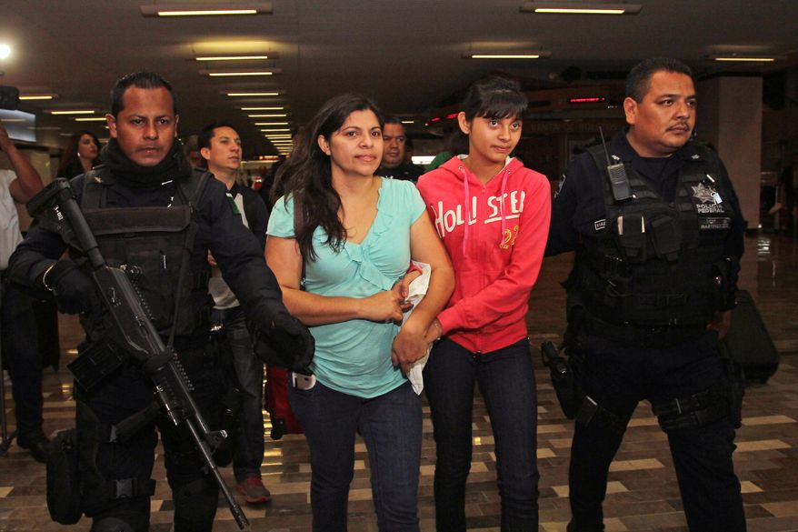 Houston resident Dorotea Garcia and 13-year-old Alondra Diaz are escorted by police as they arrive at the international airport in Guadalajara, Mexico, early Saturday May 16, 2015. Garcia got her long-missing daughter back and headed for home, concluding an eight-year search after Alondra was taken to Mexico in 2007 by her father, Reynaldo Diaz, without her mother's consent, and her whereabouts had not been known until recently. The case gained international attention last month after Mercado erroneously ruled that 14-year-old Alondra Luna was the missing girl and ordered her turned over to Garcia. (AP Photo)