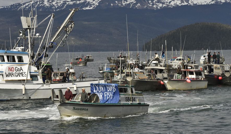 Protesters, demonstrating against the Navy's planned exercises, head out in commercial fishing boats on Orca Inlet, which opens onto the Gulf of Alaska, on Saturday, May 16, 2015, in Cordova, Alaska. They say the military activities could endanger critical fish habitats. (Mark Hoover/Eyak Preservation Council via AP)