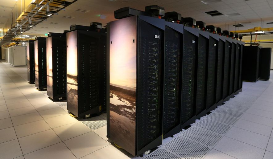 This photo taken May 5, 2015, shows the Yellowstone supercomputer at the NCAR Wyoming Supercomputing Center west of Cheyenne, Wyo. What's going on within Yellowstone's thousands of processors are some of the most elegant calculations ever performed — complex weather modeling, precise simulations and problem solving that would take even the most accomplished mathematicians millions of years to do on their own. (Michael Smith/The Wyoming Tribune Eagle via AP)