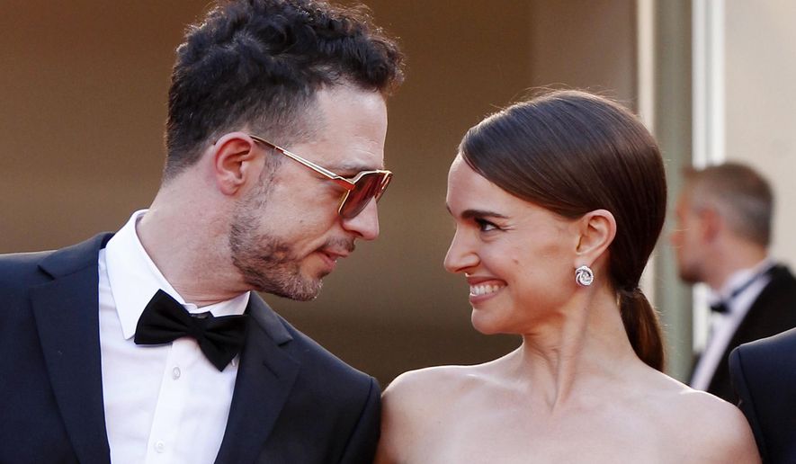 The cast of A Tale of Love and Darkness, singer Gilad Kahana, left, and director Natalie Portman look to each other as they arrive for the screening of the film Mia Madre (My Mother) at the 68th international film festival, Cannes, southern France, Saturday, May 16, 2015. (AP Photo/Lionel Cironneau)