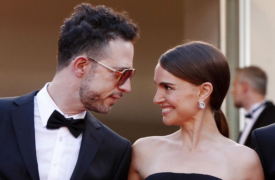 The cast of A Tale of Love and Darkness, singer Gilad Kahana, left, and director Natalie Portman look to each other as they arrive for the screening of the film Mia Madre (My Mother) at the 68th international film festival, Cannes, southern France, Saturday, May 16, 2015. (AP Photo/Lionel Cironneau)