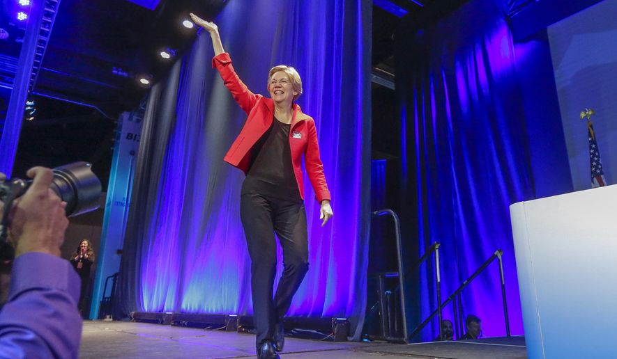 U.S. Sen. Elizabeth Warren, D-Mass., waves as she arrives at the California Democrats State Convention in Anaheim, Calif., on Saturday, May 16, 2015. (AP Photo/Damian Dovarganes)