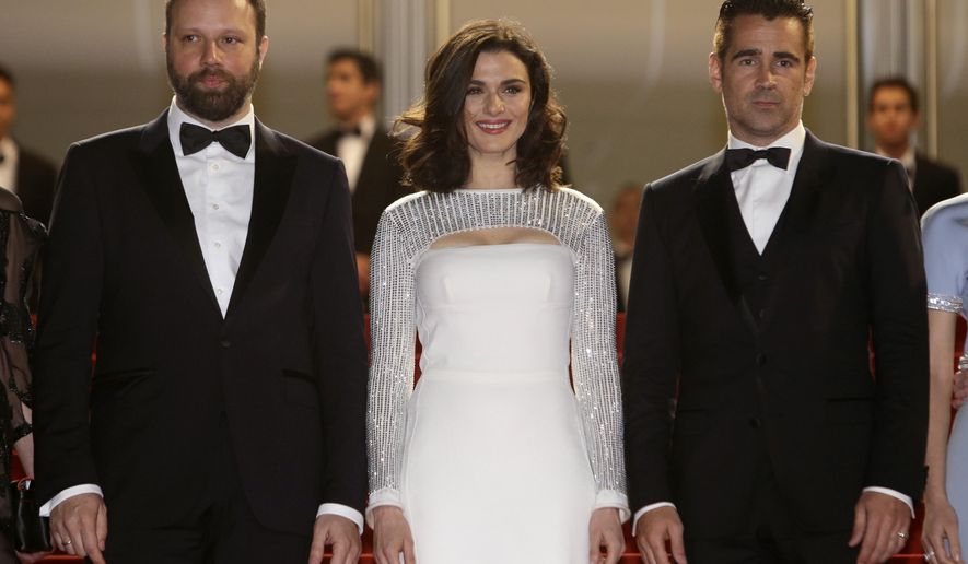 From left, director Yorgos Lanthimos, poses alongside actors Rachel Weisz, and Colin Farrell as they arrive for the screening of the film The Lobster at the 68th international film festival, Cannes, southern France, Friday, May 15, 2015. (AP Photo/Lionel Cironneau)