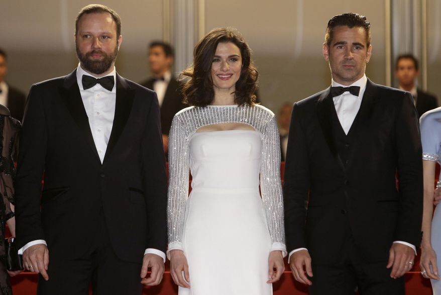 From left, director Yorgos Lanthimos, poses alongside actors Rachel Weisz, and Colin Farrell as they arrive for the screening of the film The Lobster at the 68th international film festival, Cannes, southern France, Friday, May 15, 2015. (AP Photo/Lionel Cironneau)